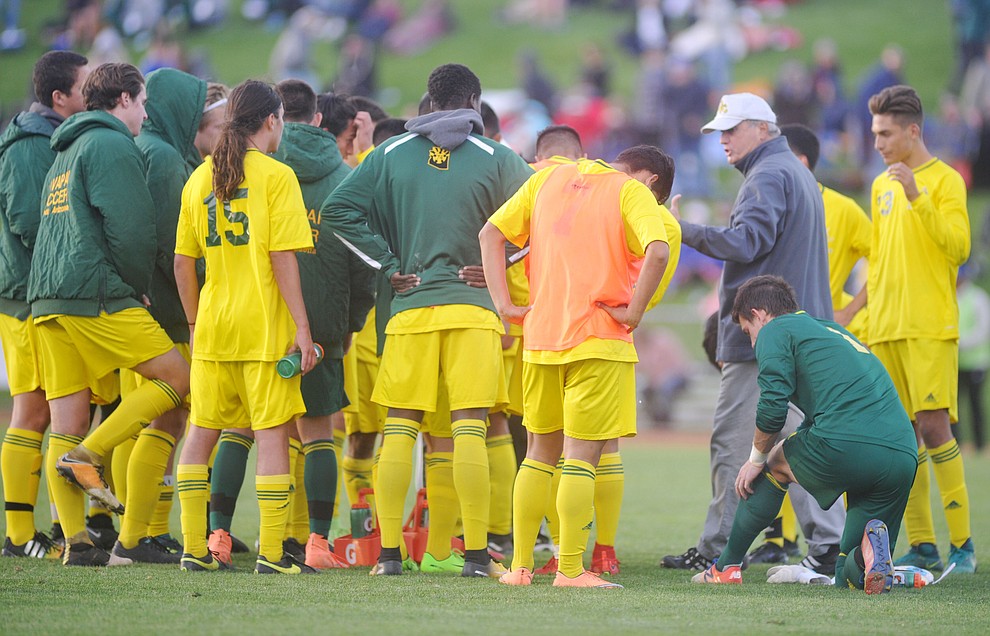 Yavapai head coach Mike Pantalione talks to the players before overtime as the Roughriders take on Tyler Community College in the semifinals of the NJCAA Division 1 Men's National Championship in Prescott Valley Friday afternoon. (Les Stukenberg/Courier)