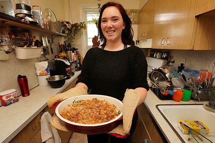 Ruthy Kirwan, of Percolate Kitchen, shows off the her version of the classic Thanksgiving favorite Green Been Casserole, in her apartment kitchen in the Queens borough of New York, Wednesday, Nov. 8. Before actors perform a play for an audience, they run a dress rehearsal to look for kinks that need fixing before the show opens. Traditional Thanksgiving dinner is a big production that can benefit from rehearsal, too, say some veteran hosts. (Richard Drew/AP)