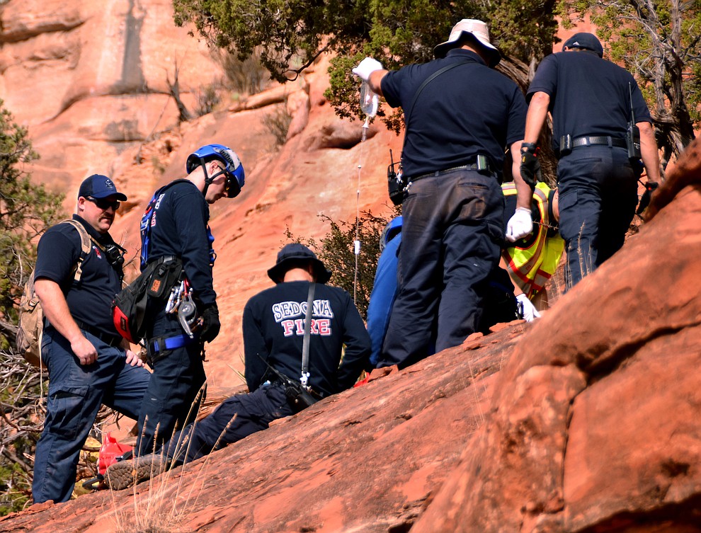 An injured hiker was carried off the Boynton Spur Trail by Sedona Fire Department personnel Monday after a technical rescue off the side of steep red rocks. (VVN/Vyto Starinskas) 