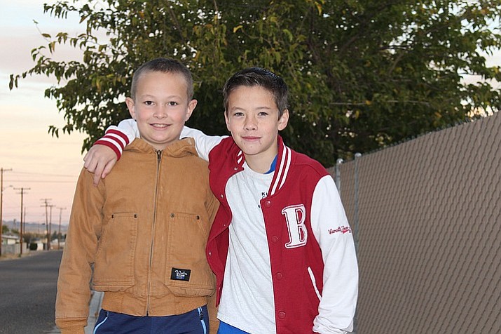 Brennon McKinney, left, and Evan Bond are best friends at Manzanita Elementary School in Kingman, Arizona. Brennon performed the Heimlich maneuver when his friend was choking on a piece of candy at the school bus stop. (Hubble Ray Smith/Kingman Daily Miner)