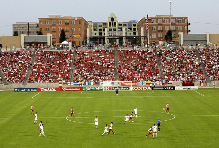 In this Aug. 6, 2005, file photo, FC Dallas and the MetroStars play during the first half of an MLS soccer game during the home opener at Pizza Hut Park in Frisco, Texas. Launched with 10 teams in 1996, two years after the U.S. hosted the World Cup, MLS expanded to 12 but cut back to 10 after the 2001 season. There has been steady growth since expansion started in 2004. Next year’s total will be 23, already well over the norm for a first division, and the league is planning to settle at 28. (Vernon Bryant/The Dallas Morning News via AP, File)