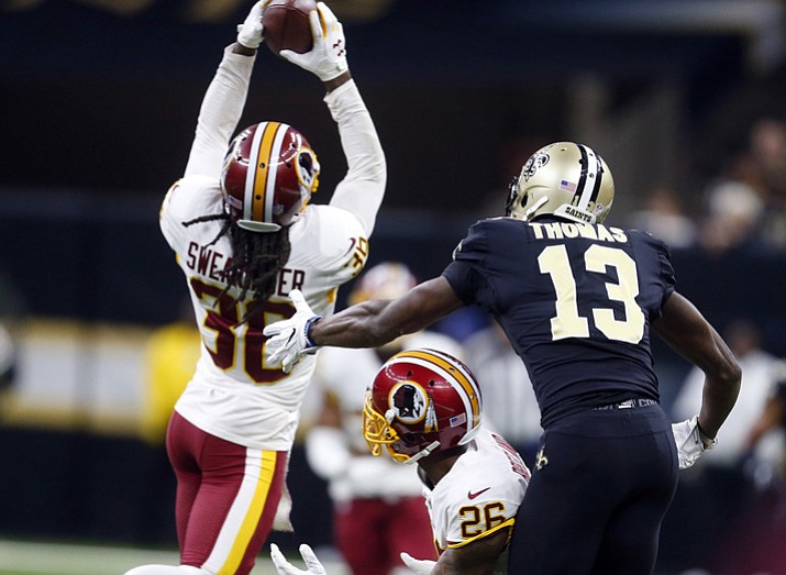 PHOTO: Washington Redskins free safety D.J. Swearinger (36) intercepts a pass intended for New Orleans Saints wide receiver Michael Thomas (13) in the first half in New Orleans, Sunday, Nov. 19, 2017. (Butch Dill/AP)