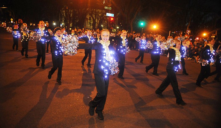 Highlights from the 22nd annual Holiday Lights Parade in downtown Prescott Saturday. The unusually warm weather helped draw a record number of entrants and a large crowd turn out to watch the annual event. 