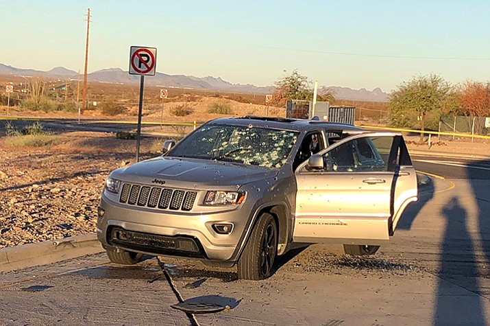 This photo provided by the Arizona Department of Public Safety shows a bullet riddled vehicle after a suspect in a Phoenix homicide was involved in a shootout with law enforcement officers at a rest area Tuesday in western Arizona. (Arizona Department of Public Safety via AP)
