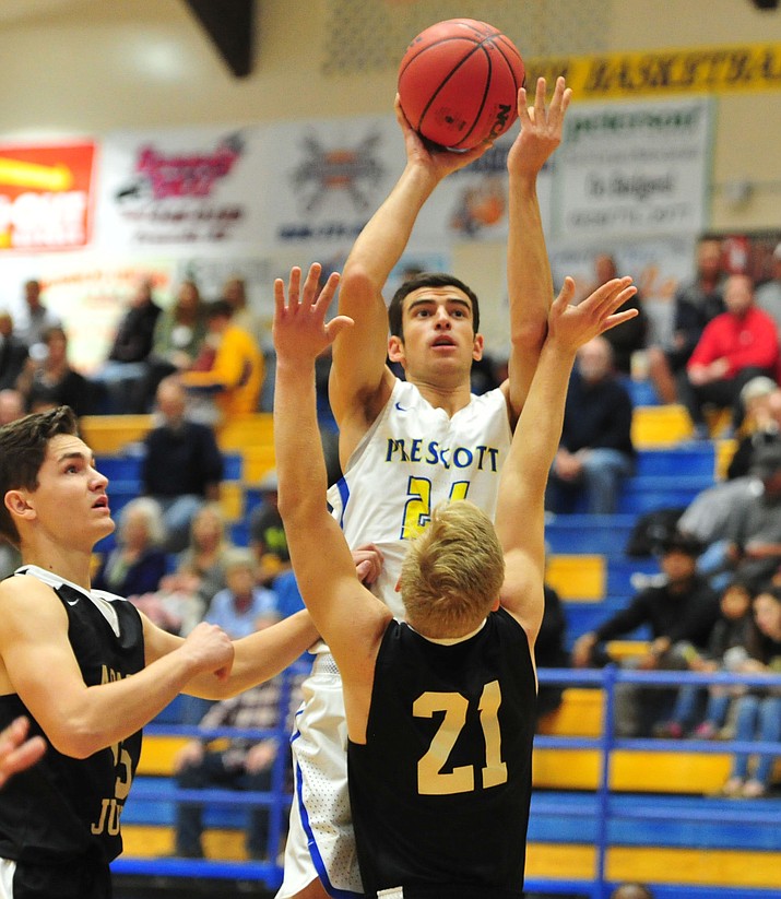 Prescott's Charles Hicks (24) goes up for a shot as the Badgers take on Apache Junction in boys basketball Wednesday night in Prescott. (Les Stukenberg/Courier)