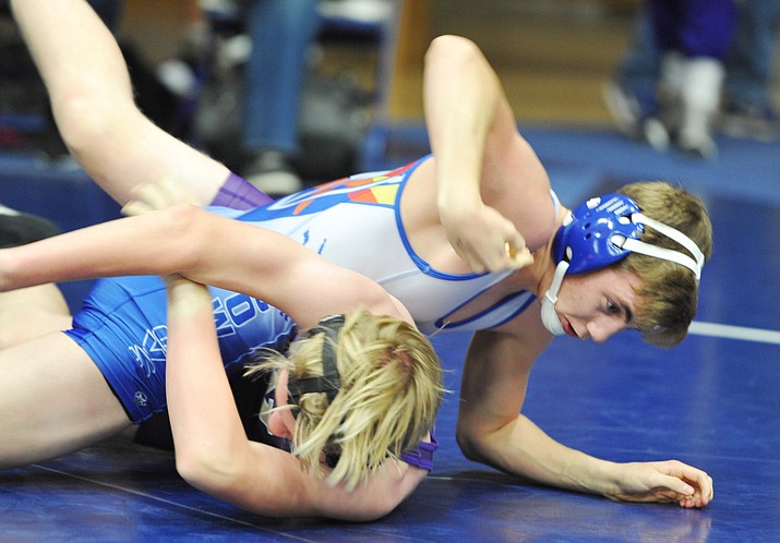 Camp Verde’s Daniel White wrestles a Wickenburg athlete during the Yavapai County Duals wrestling meet at Embry Riddle Aeronautical University Saturday. (Les Stukenberg/Courier)