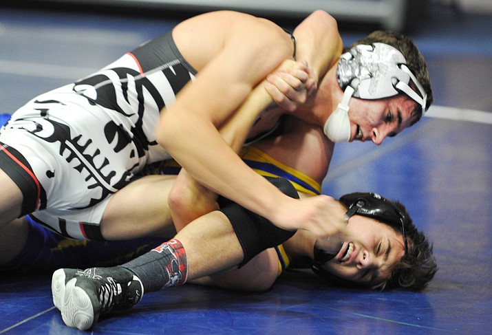 Mingus’ Trent Miller  wrestles Prescott’s Darian Bowyer during the Yavapai County Duals wrestling meet at Embry Riddle Aeronautical University Saturday. (Les Stukenberg/Courier)