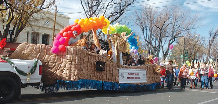 Sacred Hearth Catholic School made this float entirely from recyclable materials, and planned to re-recycle it after the 35th Annual Prescott Christmas Parade took place on Saturday, Dec. 2. More photos at dCourier.com. (Les Stukenberg/Courier)