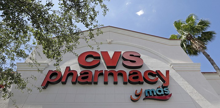 Pharmacy giant CVS will buy insurance giant Aetna in a roughly $69 billion deal that will help the drugstore chain provide more health care and keep a key client, according to a person with knowledge of the matter. (AP Photo/Alan Diaz, File)

