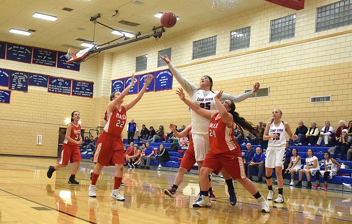 Camp Verde sophomore Jacy Finley grabs a rebound during the Cowboys’ 48-17 win over Mayer. Finley is averaging 12 points and 12 rebounds through Dec. 6. (VVN/James Kelley)