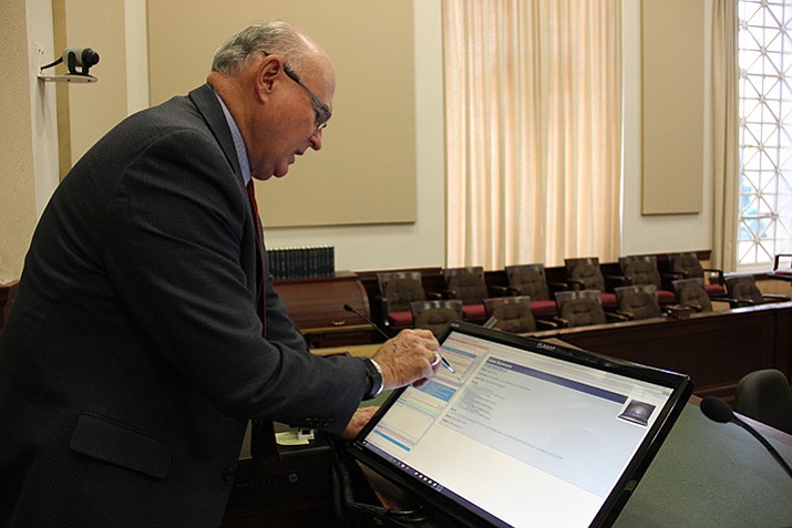 Judge David Mackey, division 1 judge for the Yavapai County Superior Court, demonstrates how eBench works in his courtroom. (Max Efrein/Courier)
