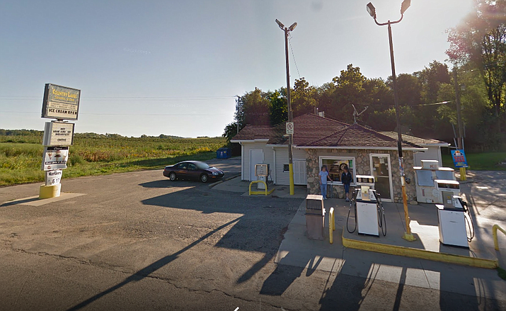 Carl Trumbla tells WWMT-TV the masked man walked into Country Lakes General Store in Van Buren County on Monday with a scratch-off ticket, claiming it was a winner. Trumbla says he turned his back to scan the ticket and the man fled on foot with other tickets. (Google Street View photo)