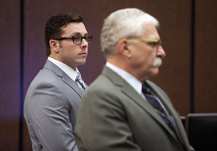 In this  October file photo, Former Mesa police officer Philip Brailsford, left, and his attorney, Mike Piccarreta, stand for the jury, at the start of Brailsford’s murder trial at Maricopa County Superior Court in Phoenix.  (David Wallace/The Arizona Republic via AP, File)