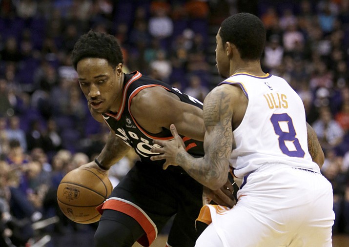 Toronto Raptors guard DeMar DeRozan drives on Phoenix Suns guard Tyler Ulis (8) in the first quarter Wednesday, Dec 13, 2017, in Phoenix. (Rick Scuteri/AP)