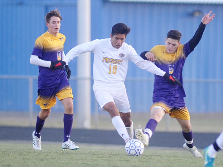 Fernando Rodriguez (10) battles for the ball as the Prescott boys’ soccer team takes on Sunrise Mountain on Thursday, Dec. 14, 2017, in Prescott. (Les Stukenberg/Courier)