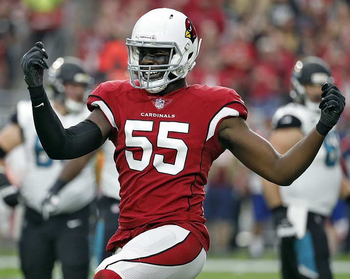 In this Nov. 26, 2017, file photo, Arizona Cardinals outside linebacker Chandler Jones (55) celebrates a defensive stop against the Jacksonville Jaguars during the first half of an NFL football game in Glendale. Jones is having the kind of monster season the Cardinals envisioned when they rewarded him with such a big contract. (Rick Scuteri/AP, File)