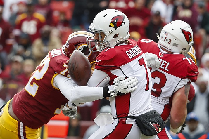 Washington Redskins defensive lineman Anthony Lanier (72) sacks Arizona Cardinals quarterback Blaine Gabbert (7), forcing a fumble and a turnover resulting in a Redskins touchdown during the first half of an NFL football game in Landover, Md., Sunday, Dec 17. (Alex Brandon/AP)