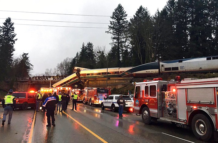 This photo provided by Washington State Patrol shows an Amtrak train that derailed south of Seattle on Monday, Dec. 18, 2017. Authorities reported "injuries and casualties." The train derailed about 40 miles (64 kilometers) south of Seattle before 8 a.m., spilling at least one train car on to busy Interstate 5. (Washington State Patrol via AP)
