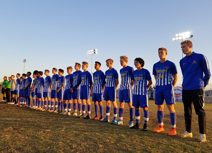 Members of the Prescott boys’ soccer team line up for the national anthem prior their matchup with Moon Valley on Tuesday, Dec. 19, 2017, in Phoenix. The Badgers edged the Rockets 3-2. (PHS Athletics/Courtesy)