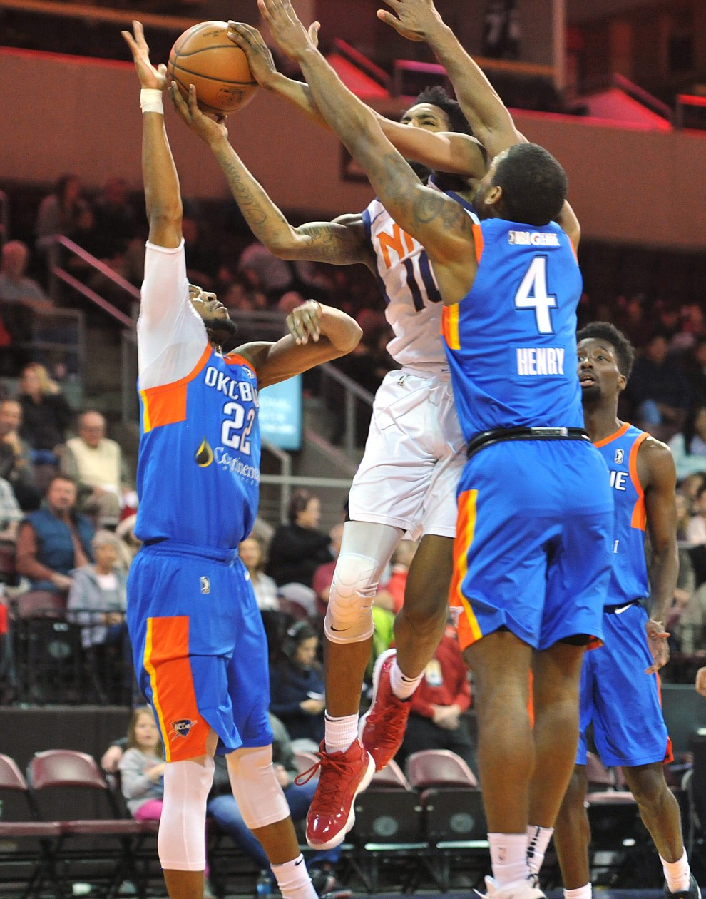Northern Arizona's Derrick Jones Jr. splits a pair of defenders as the Suns take on the Oklahoma City Blue Friday night at the Prescott Valley Event Center.  (Les Stukenberg/Courier)