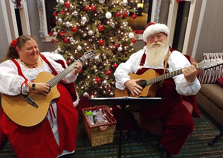 Santa and Mrs. Claus singing Christmas carols. (Courtesy)