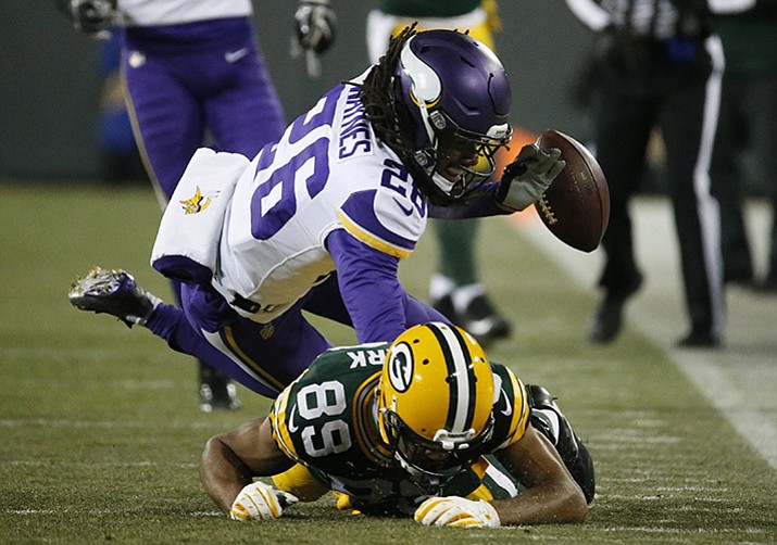 Minnesota Vikings’ Trae Waynes breaks up a pass intended for Green Bay Packers’ Michael Clark during the first half of an NFL football game Saturday, Dec. 23, 2017, in Green Bay.