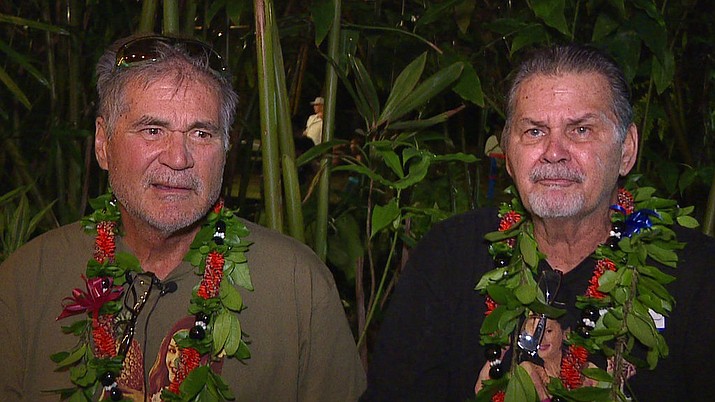 In this Dec. 23, 2017, image made from a video provided by Honolulu news station KHON, Alan Robinson and Walter Macfarlane are interviewed in Honolulu. The two Hawaii men grew up as best friends and recently learned that they're actually brothers. They revealed the surprise to family and friends over the holidays. The two, who have been friends for 60 years, were born in Hawaii 15 months apart and met in the sixth grade. (KHON via AP)
