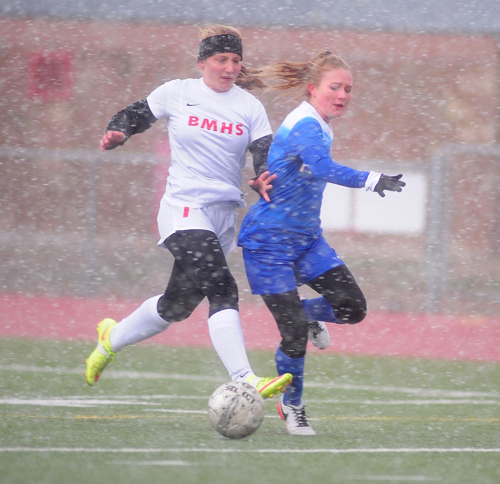 Bradshaw Mountain's Marissa Archer moves Prescott's Mikayla Sell off the ball as the Lady Bears hosted the Prescott Lady Badgers in a cross-town rivalry soccer game Tuesday, January 24 in Prescott Valley.  (Les Stukenberg/The Daily Courier)