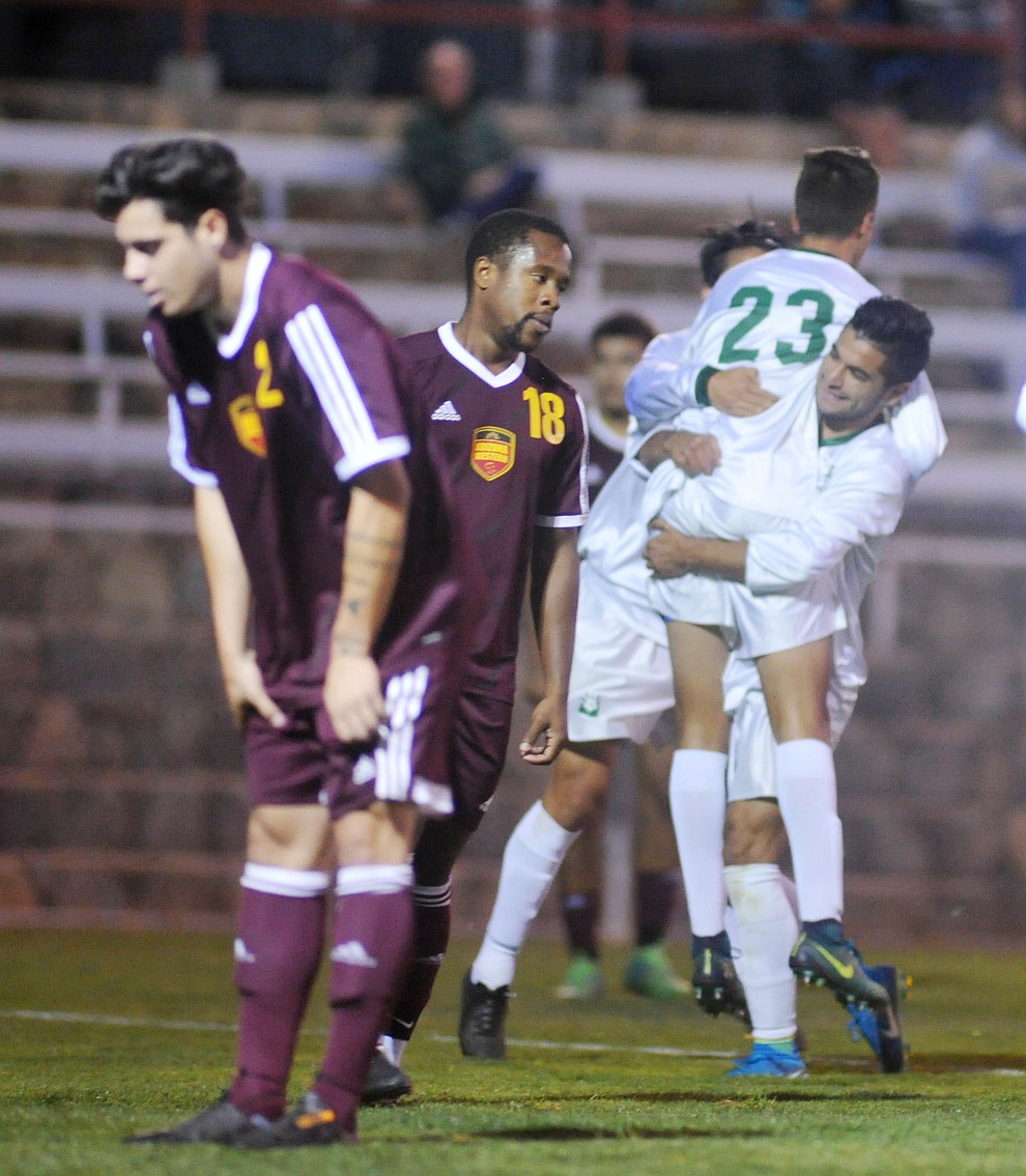 Yavapai players celebrate John Scearce's (23) first half goal as the Roughriders take on Arizona Western in a soccer matchup Tuesday night in Prescott. (Les Stukenberg/Courier)