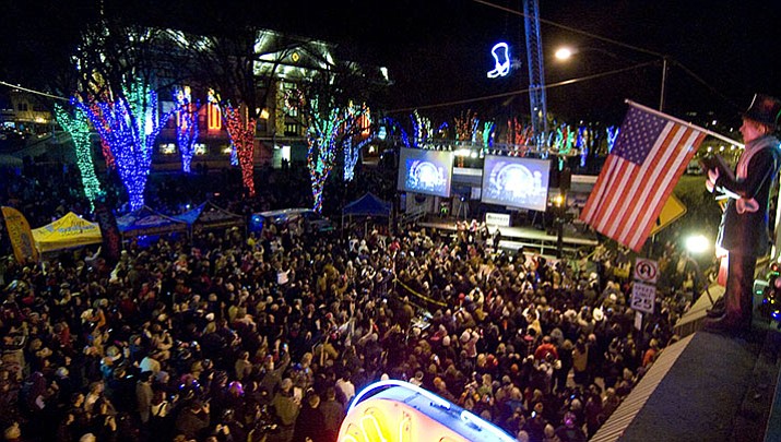 New Year's Eve partiers blanket Montezuma Street and Whiskey Row at the Boot Drop. This year's event is the seventh annual.