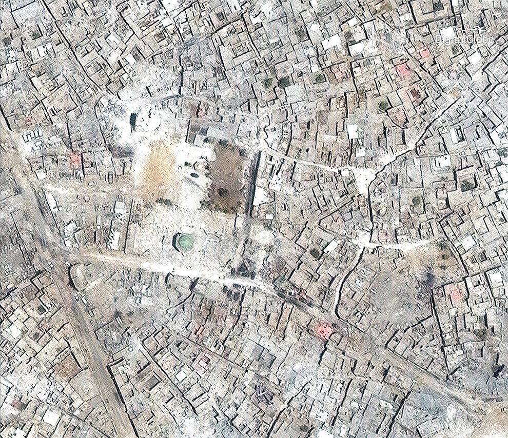 This satellite image released by DigitalGlobe shows what remains of the al-Nuri Mosque in Mosul, Iraq on July 8, 2017. Three years of war devastated much of northern and western Iraq. Baghdad estimates $100 billion is needed nationwide to rebuild. Local leaders in Mosul, the biggest city held by IS, say that amount is needed to rehabilitate their city alone. (DigitalGlobe via AP)