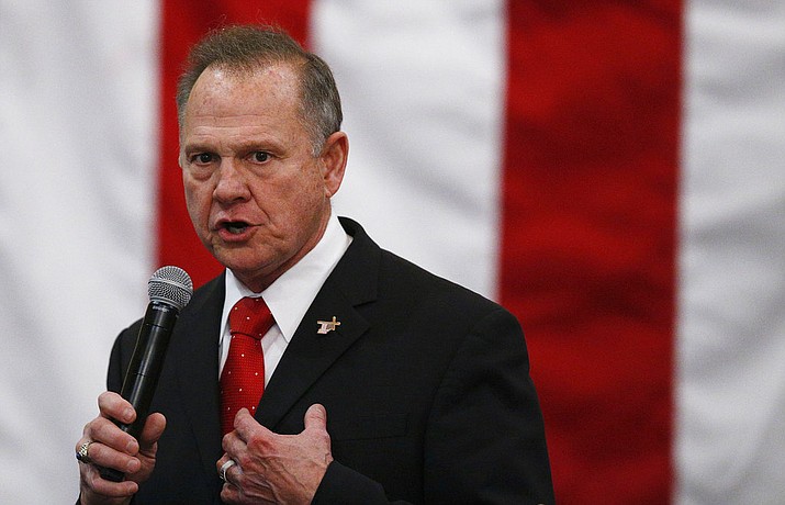 FILE- In this Dec. 11, 2017, file photo, U.S. Senate candidate Roy Moore speaks at a campaign rally in Midland City, Ala. Moore is going to court to try to stop Alabama from certifying Democrat Doug Jones as the winner of the U.S. Senate race. Moore filed a lawsuit Wednesday evening, Dec. 27, 2017, in Montgomery Circuit Court. (AP Photo/Brynn Anderson, File)

