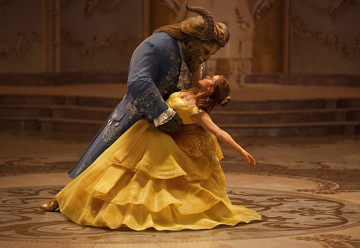 FILE - This file image released by Disney shows Dan Stevens as The Beast, left, and Emma Watson as Belle in a live-action adaptation of the animated classic "Beauty and the Beast." Bolstered by hits like “Star Wars: The Last Jedi” and “Beauty and the Beast,” the Walt Disney Company is the top grossing studio at the 2017 domestic box office with over $2.2 billion in revenue and 21.2 percent of the market share.(Disney via AP, File)

