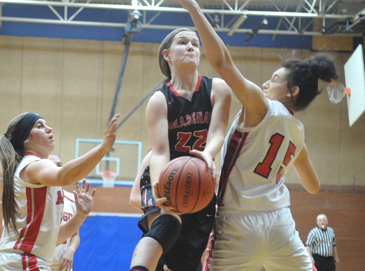 Bradshaw Mountain’s Mica Nellis goes hard to the rim at the Lady Badgers Winter Classic on Friday, Dec. 29, 2017, in Prescott. (Les Stukenberg/Courier) 