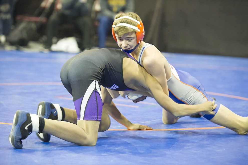 Chino Valley's  Jason Ehlert defeated Jonathan Carrasquillo in the opening round of the Mile High Challenge Wrestling Tournament at the Prescott Valley Event Center Friday morning.  (Les Stukenberg/Courier)