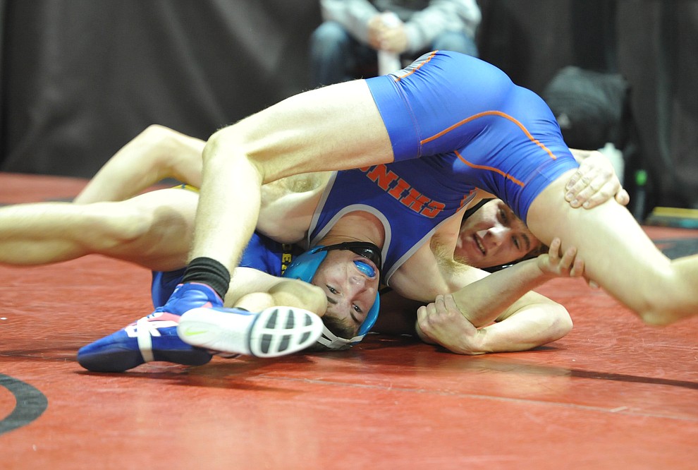  Chino Valley's JC Mortenson wrestles Prescott's Koby Coates in one of the most entertaining matches in the Mile High Challenge consolation bracket Saturday afternoon at the Prescott Valley Event Center. Coates ended up victorious in a back and forth match. (Les Stukenberg/Courier)