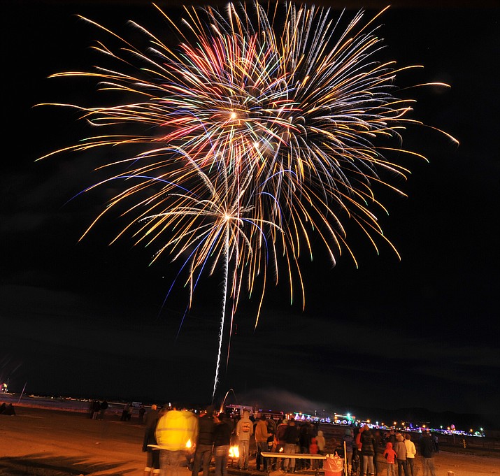 Fireworks light the sky as Prescott Valley hosted their first community New Year's eve celebration Sunday night at the Prescott Valley Event Center. The town and Cental Yavapai Fire & Medical hosted the event providing s'mores, hot cocoa, games, a bonfire and two fireworks shows. (Les Stukenberg/Courier)