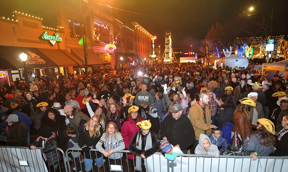 Large crowds are partying during the 7th annual New Year's eve Whiskey Row Boot Drop in Prescott Sunday night.  (Les Stukenberg/Courier)
