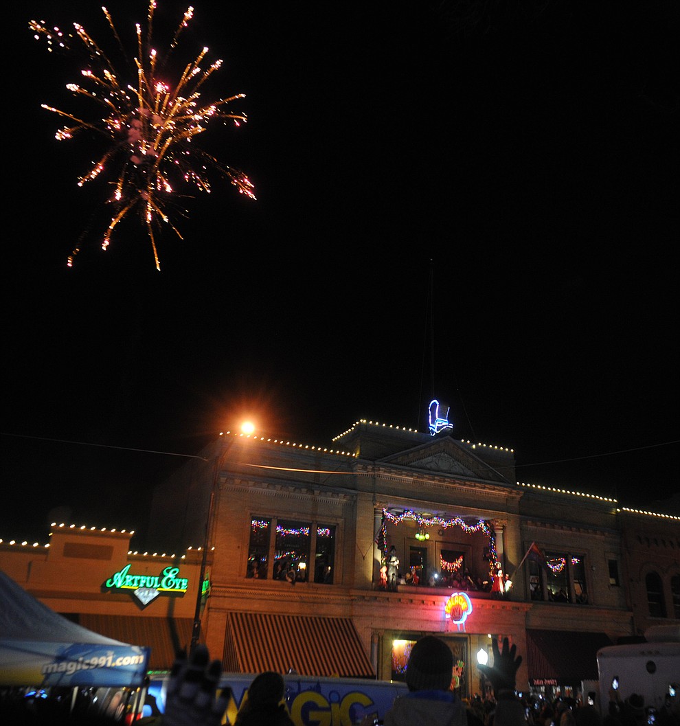 Fireworks light the sky during the 7th annual New Year's eve Whiskey Row Boot Drop in Prescott Sunday night.  (Les Stukenberg/Courier)