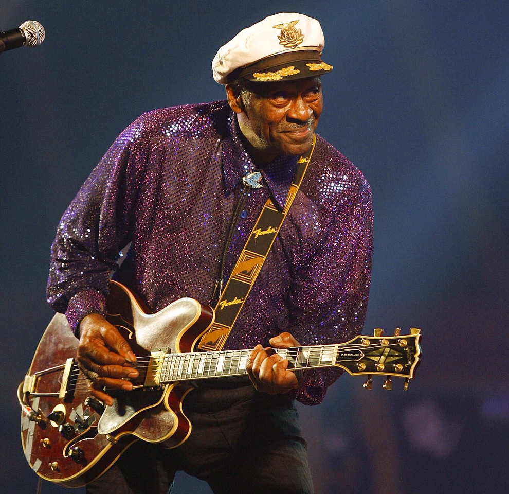 FILE - In this Nov. 25, 2007 file photo, legendary U.S. rock and roll singer and guitarist Chuck Berry performs in Burgos, Spain. Rock 'n' roll founding father Berry was among the notable figures who died in 2017. (AP Photo/Israel Lopez Murillo, File)