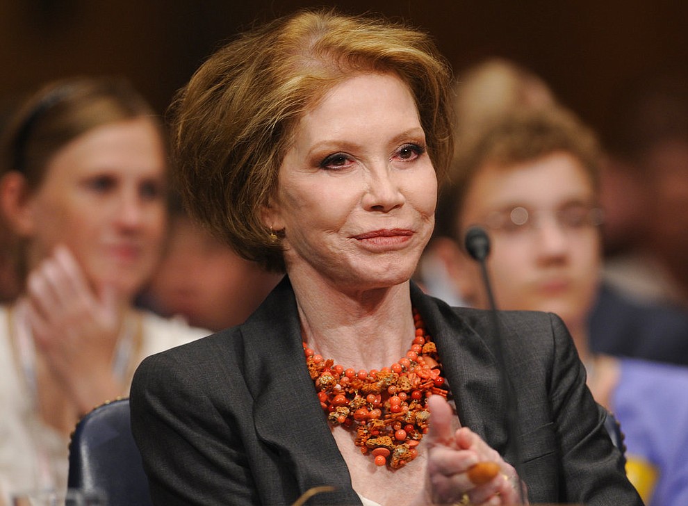 FILE - In this June 24, 2009 file photo, actress Mary Tyler Moore waits to testify on Capitol Hill in Washington before the Senate Homeland Security and Governmental Affairs Committee hearing on Type 1 Diabetes Research. Moore was among the notable figures who died in 2017. (AP Photo/Susan Walsh, File)