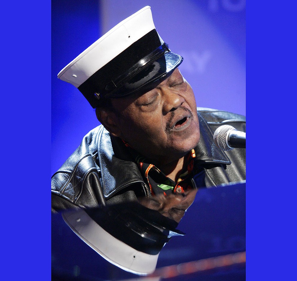 FILE - In this Nov. 9, 2007 file photo, music legend Fats Domino performs on the NBC "Today" television show in New York. Domino, the amiable rock 'n' roll pioneer whose steady, pounding piano and easy baritone helped change popular music even as it honored the grand, good-humored tradition of the Crescent City, has died. He was 89. Mark Bone, chief investigator with the Jefferson Parish, Louisiana, coroner's office, said Domino died Tuesday, Oct. 24, 2017. (AP Photo/Richard Drew, File)