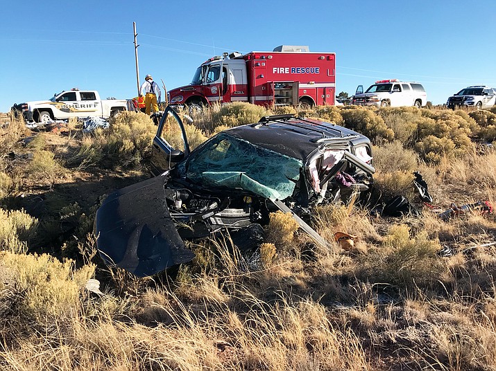 A Dodge van rests along State Route 64 after colliding with a Hyundai sedan. The drivers of both vehicles and one passenger were killed on impact. A second passenger died at the scene.