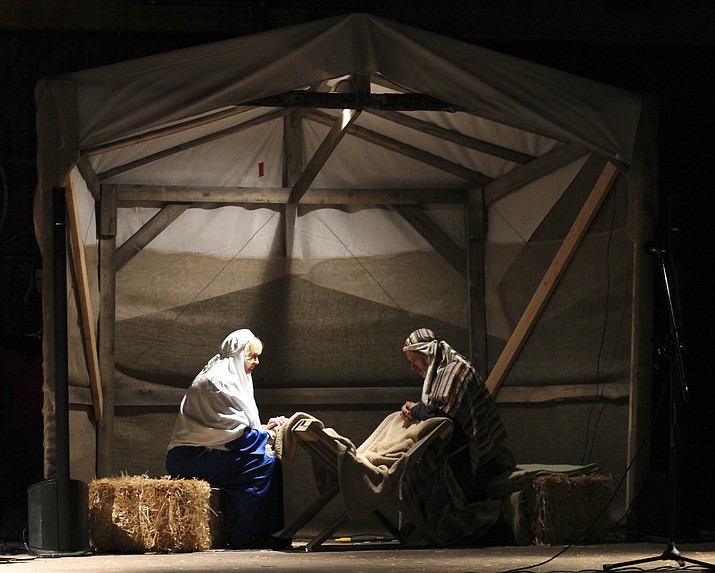 Mary and Joseph observe the Baby Jesus during the second annual Christmas Nativity pageant in Williams Dec. 22.