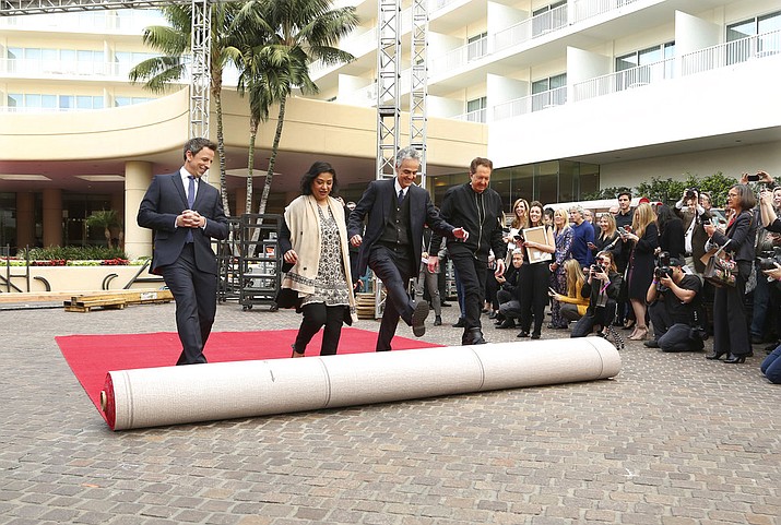 Seth Meyers, from left, Meher Tatna, Allen Shapiro and Barry Adelman roll out the red carpet at the 75th Annual Golden Globe Awards Preview Day at The Beverly Hilton on Thursday, Jan. 4, 2018, in Beverly Hills, Calif. (Photo by Willy Sanjuan/Invision/AP)
