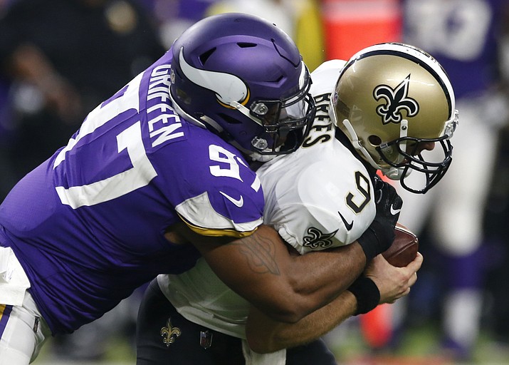 In this Sept. 11, 2017, file photo, New Orleans Saints quarterback Drew Brees (9) is sacked by Minnesota Vikings defensive end Everson Griffen (97) during the first half of an NFL football game in Minneapolis. (Jim Mone/AP, File)