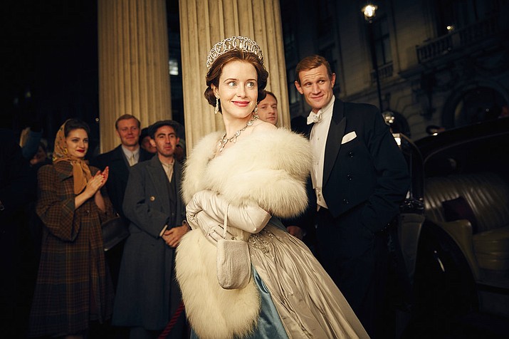 This image released by Netflix shows Claire Foy, center, and Matt Smith, right, in a scene from "The Crown." The New York Times website recaps each episode of "The Crown" in text stories, but it goes the extra mile. Through the miracle of hyperlinks and its own "Times Machine" function, the site links wanderers to the paper's original reporting _ and its original pages in PDFs detailing numerous actual events covered in the series. (Robert Viglasky/Netflix via AP)
