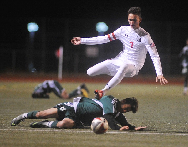 Bradshaw Mountain High School’s Brandon Fischer gets fouled as the Bears take on Flagstaff High Wednesday night in a boys soccer game in Prescott Valley. 