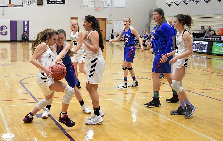 Camp Verde sophomore Anna Peterson goes for a steal during the Cowboys’ 62-36 loss at No. 3 Sedona Red Rock on Tuesday night. The defeat was the Cowboys’ first regular season one against a fellow 2A squad this year. (VVN/James Kelley)