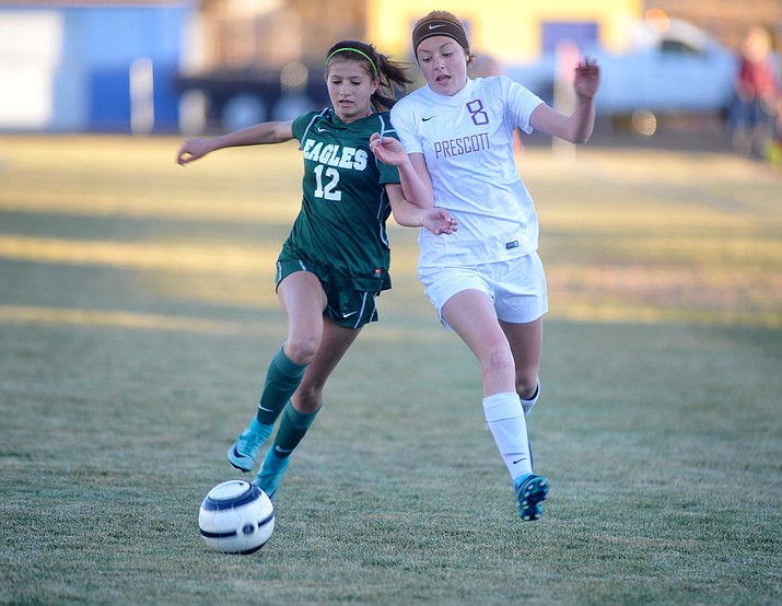 Prescott’s Erika Smith (8) battles with Anna Harmon for possession as the Badgers take on Flagstaff on Thursday, Jan. 11, 2018, in Prescott. (Les Stukenberg/Courier)